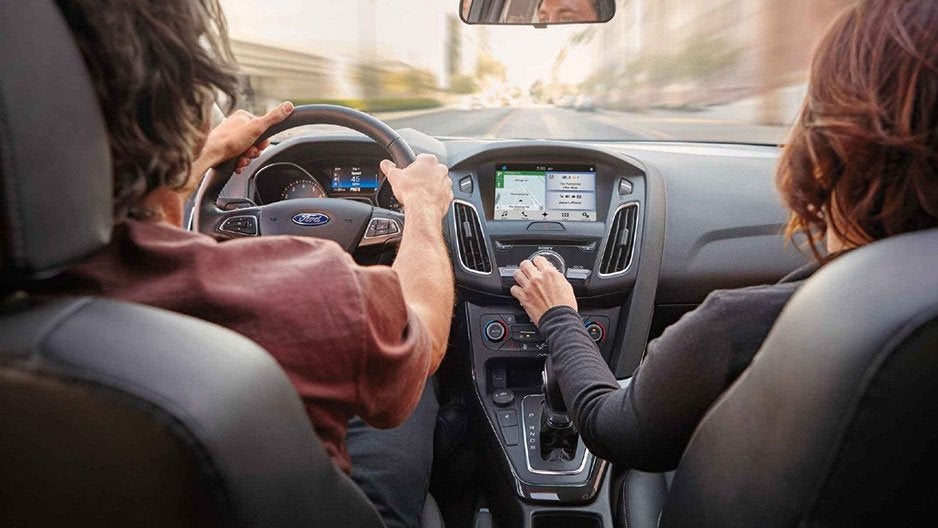 Woman turning AC Knob